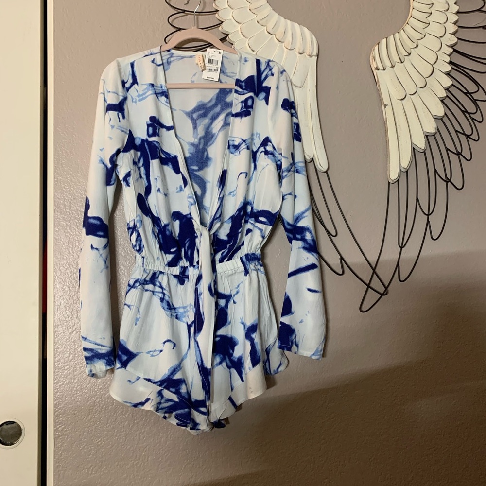 New w/ tags. Tie-dye shorts and top. L